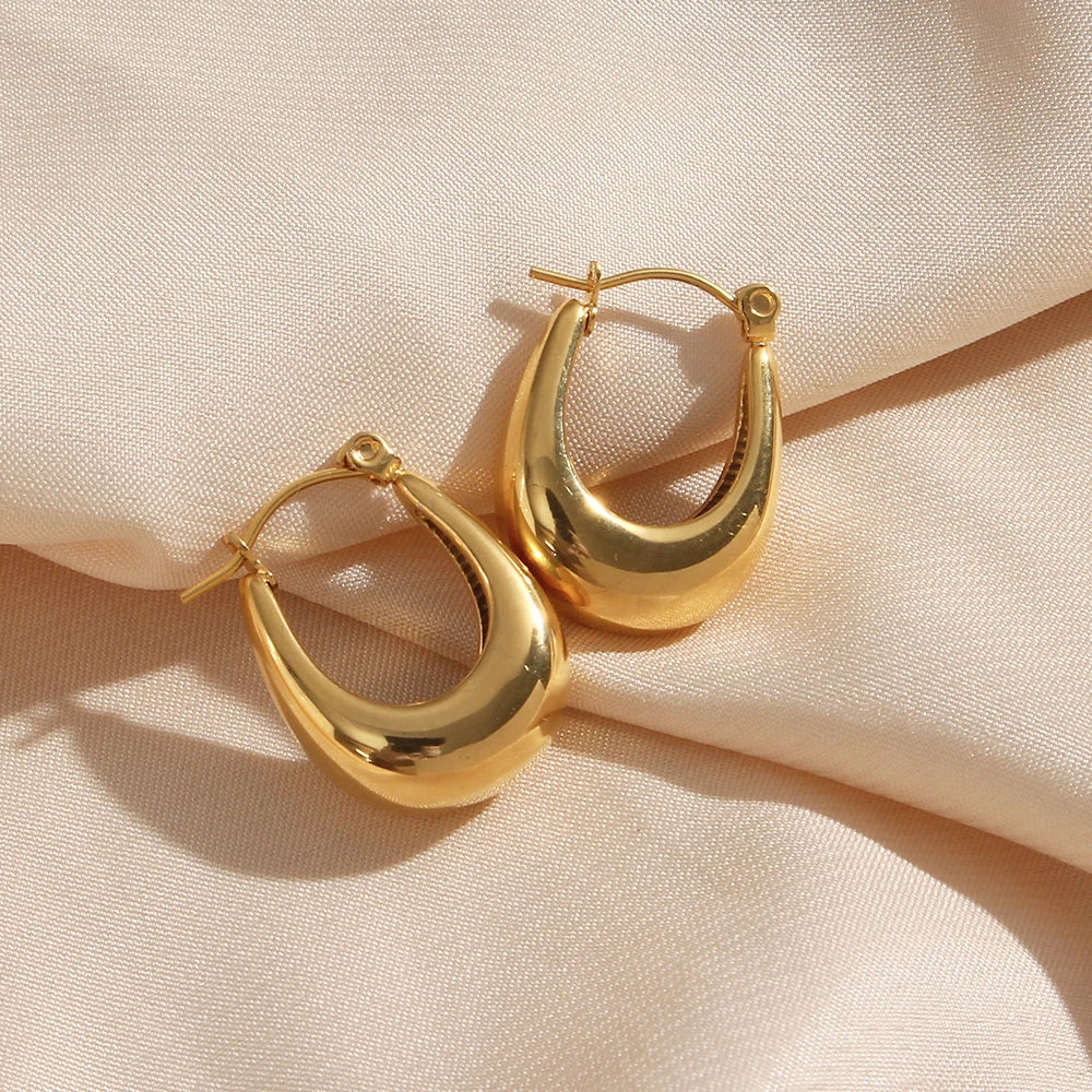 Image of Minimal Waterproof U-Shaped Hoops: Sleek and versatile hoops with a contemporary U-shaped design, crafted to elevate your style. Water-resistant for all occasions, these minimalistic earrings add a touch of modern elegance to any look.