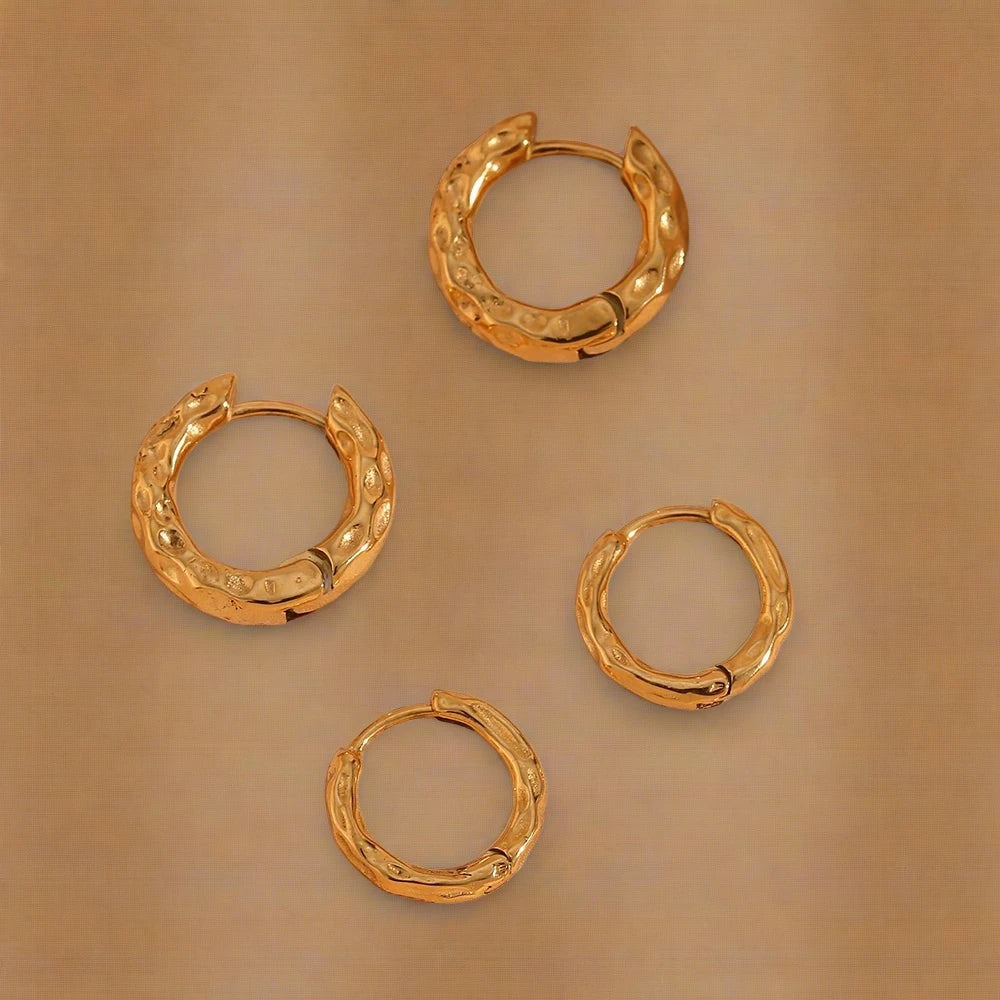 Golden Glamour - Ella Collection - A stunning shot of the gold-plated hoops with a hammered surface, radiating elegance.