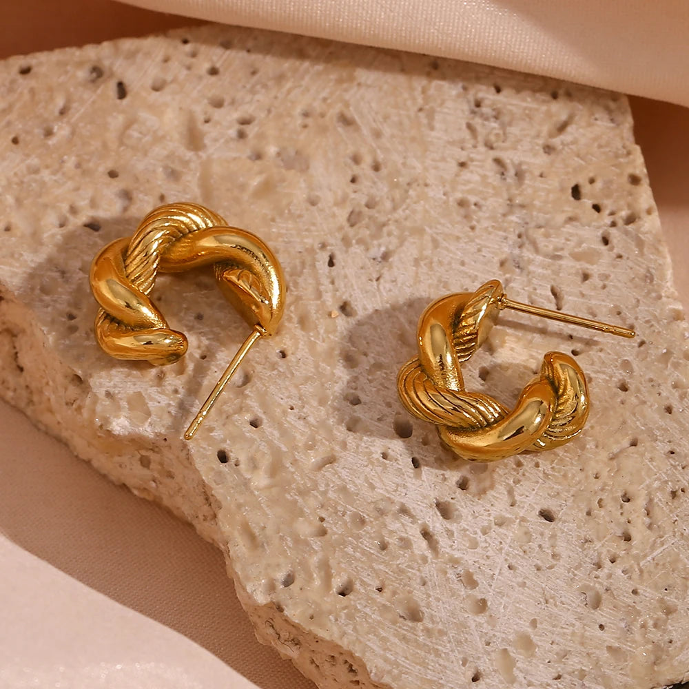 Image: Minimal Gold Tarnish-Free Chunky Hoop Earring. Bold twist style hoop with texture. 