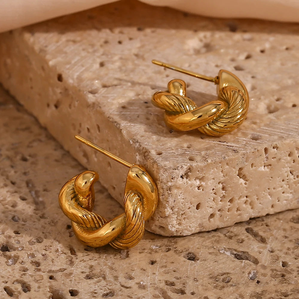 Image: Minimal Gold Tarnish-Free Chunky Hoop Earring. Bold twist style hoop with texture. 